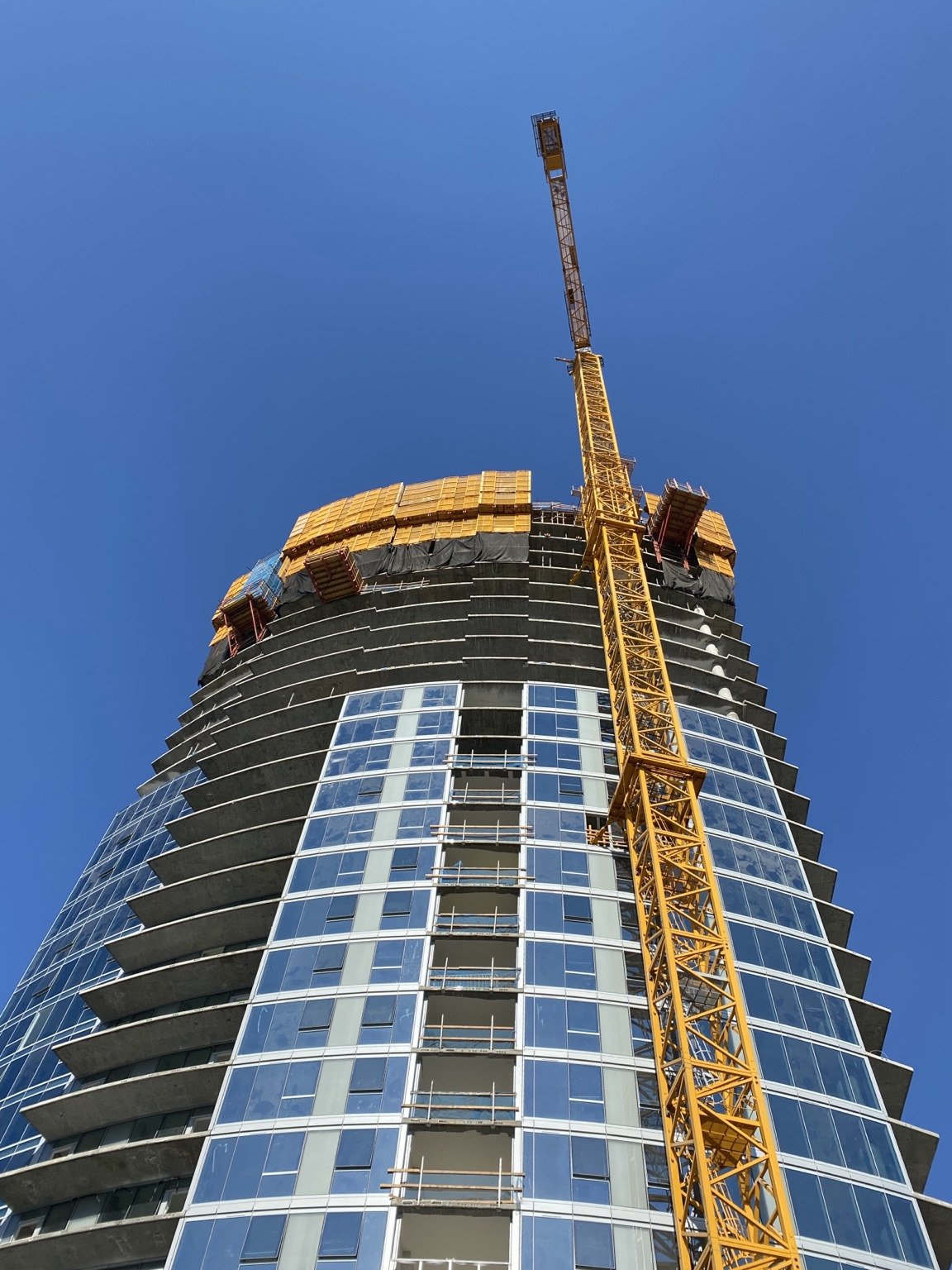 High-rise construction and tower crane