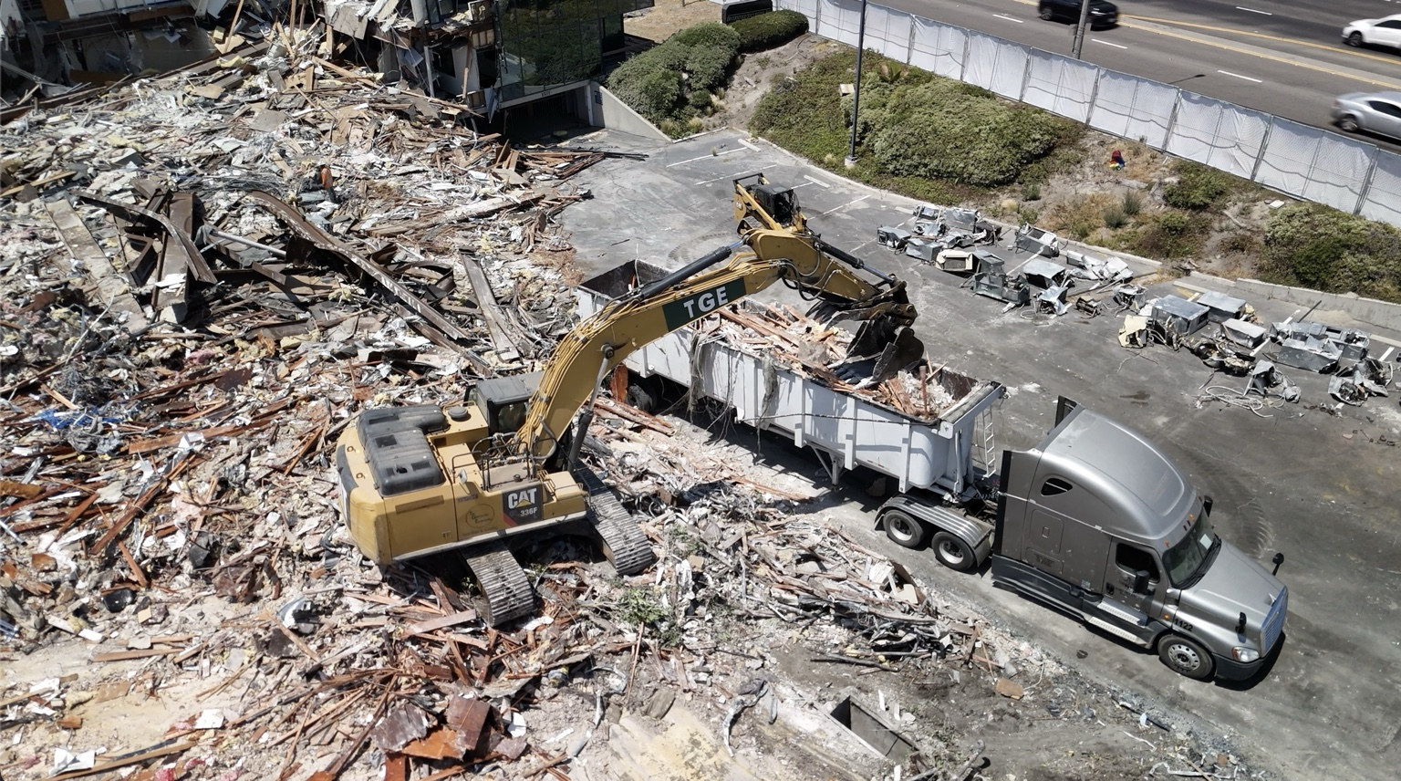 Excavator loading demolition debris